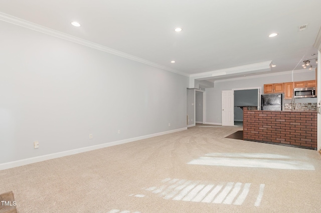 unfurnished living room featuring crown molding, baseboards, and light carpet