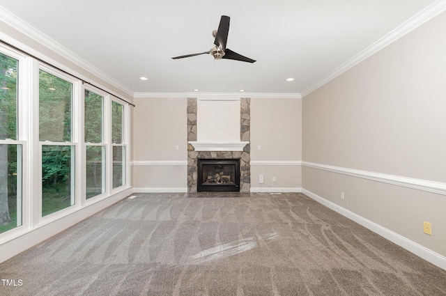 unfurnished living room featuring carpet flooring, a ceiling fan, baseboards, and ornamental molding