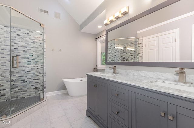 bathroom featuring visible vents, a sink, marble finish floor, and vaulted ceiling