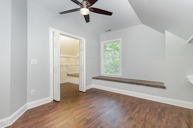 bonus room featuring a ceiling fan, baseboards, vaulted ceiling, and wood finished floors