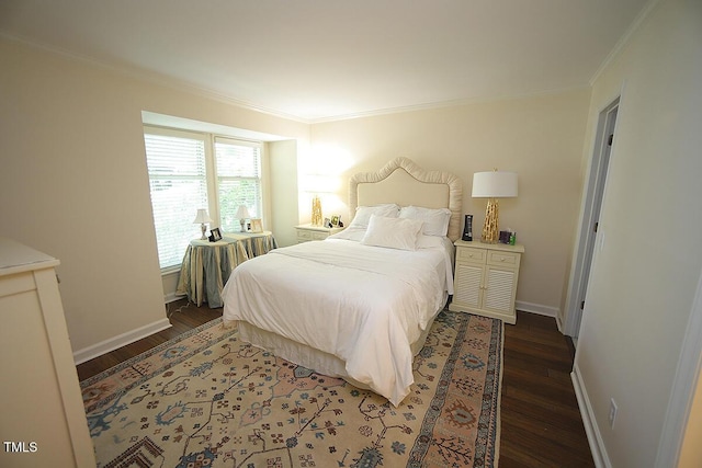 bedroom with ornamental molding and wood finished floors