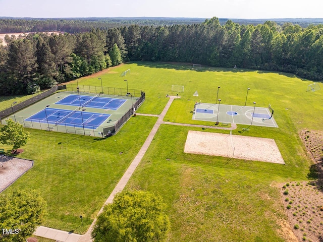 drone / aerial view featuring a wooded view