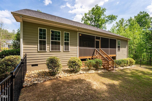 ranch-style house featuring fence, stairs, a front lawn, a sunroom, and crawl space