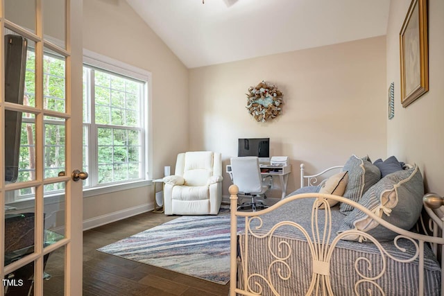 office area with baseboards, vaulted ceiling, and dark wood-style floors