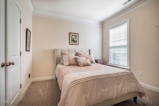 bedroom with visible vents, ornamental molding, carpet, and multiple windows