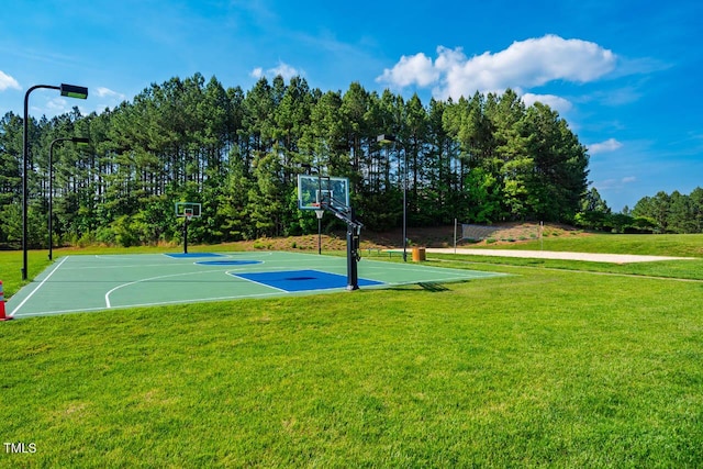 view of sport court featuring a yard and community basketball court