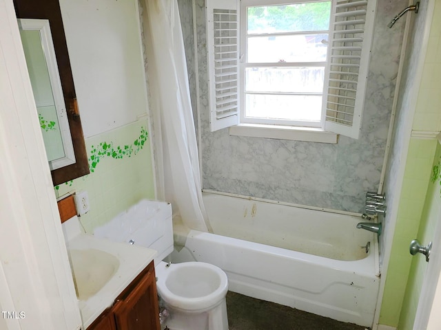 full bathroom with vanity, shower / bath combo, and toilet
