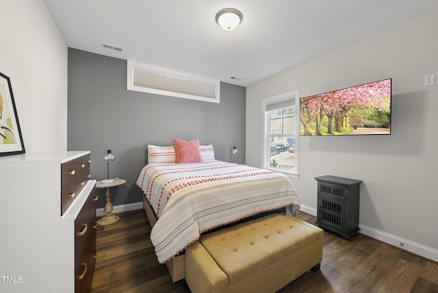 110 Deacon Ridge Ln, Youngsville, NC 27596 - bedroom featuring baseboards, visible vents, and dark wood finished floors