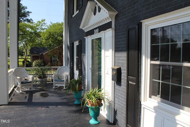 exterior space with brick siding