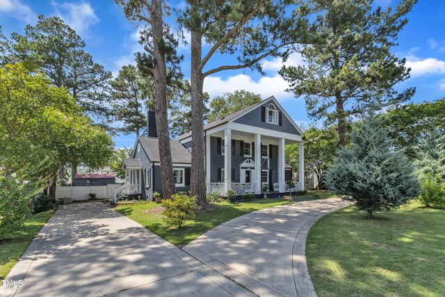 300 S Pine St, Benson, NC 27504 - greek revival house featuring a porch and a front lawn