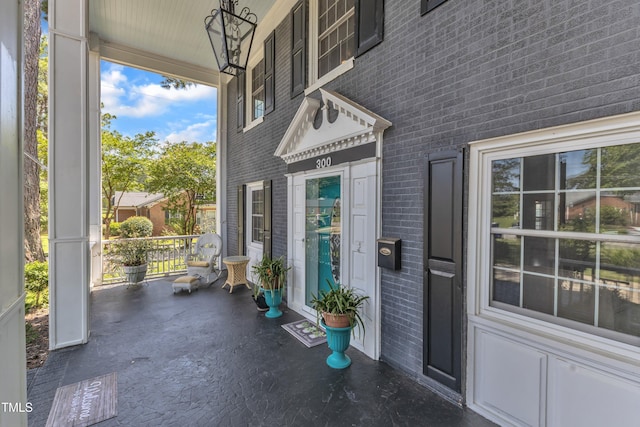 300 S Pine St, Benson, NC 27504 - view of exterior entry featuring brick siding and covered porch