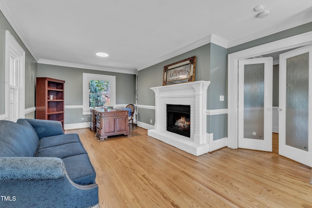 300 S Pine St, Benson, NC 27504 - living area featuring light wood-style floors, a fireplace, and ornamental molding