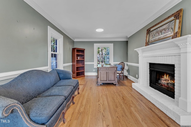 300 S Pine St, Benson, NC 27504 - living area featuring light wood finished floors, a fireplace, and ornamental molding