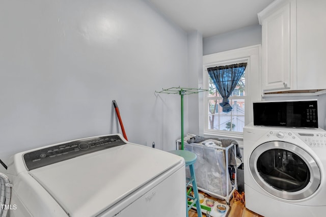 300 S Pine St, Benson, NC 27504 - laundry area featuring cabinet space and independent washer and dryer