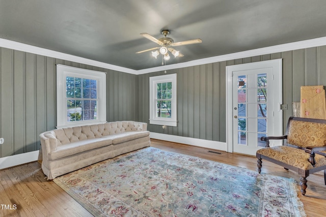 300 S Pine St, Benson, NC 27504 - living area with ornamental molding, wood finished floors, and ceiling fan