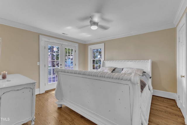 300 S Pine St, Benson, NC 27504 - bedroom featuring access to outside, crown molding, french doors, light wood-style floors, and a ceiling fan