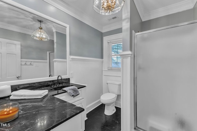 300 S Pine St, Benson, NC 27504 - bathroom featuring a wainscoted wall, a chandelier, a stall shower, vanity, and ornamental molding