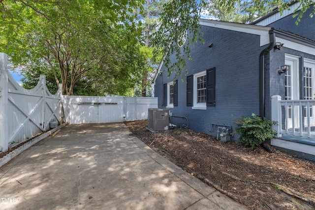 300 S Pine St, Benson, NC 27504 - view of side of property featuring brick siding, a gate, and crawl space