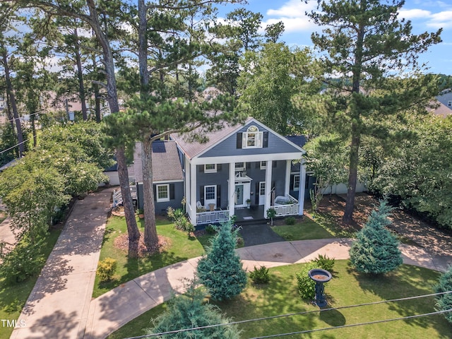 300 S Pine St, Benson, NC 27504 - neoclassical / greek revival house featuring a porch, a front lawn, and stucco siding