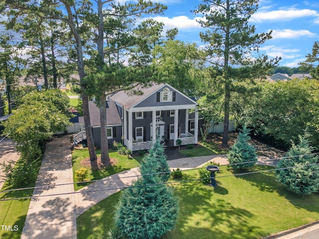 300 S Pine St, Benson, NC 27504 - greek revival inspired property featuring covered porch, a front yard, and roof with shingles