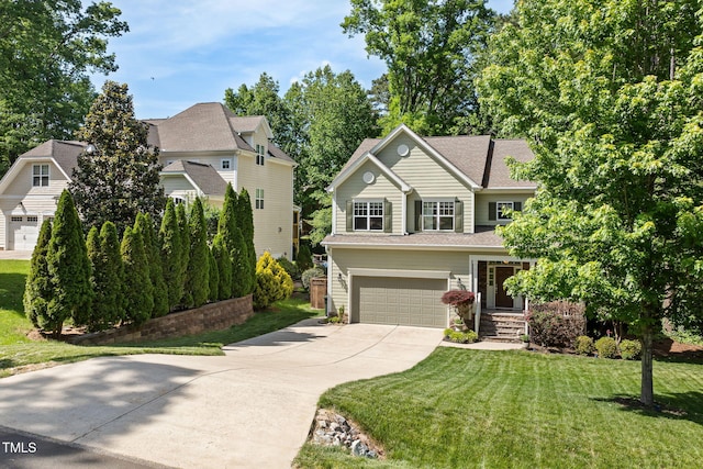 view of front facade featuring roof with shingles, an attached garage, concrete driveway, and a front lawn