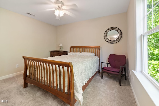 bedroom featuring carpet flooring, baseboards, visible vents, and ceiling fan