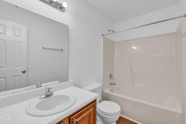 7109 Spanglers Spring Way, Raleigh, NC 27610 - full bathroom featuring vanity, tub / shower combination, toilet, and wood finished floors