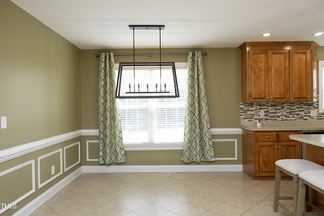 dining room featuring recessed lighting, light tile patterned flooring, and a wealth of natural light