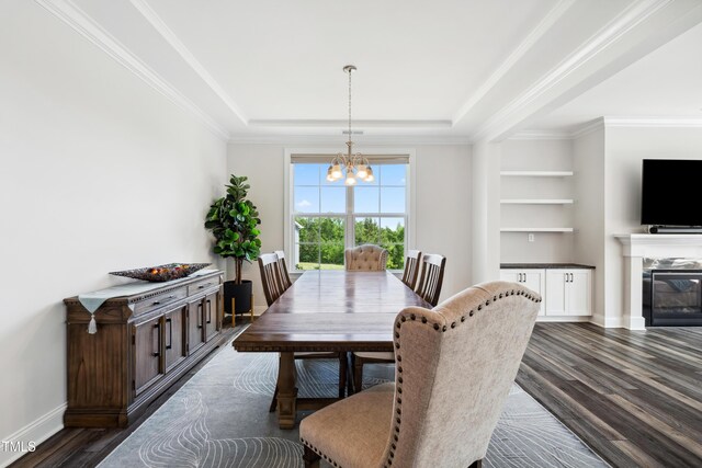 46 Waterfall Pointe, Chapel Hill, NC 27517 - dining room with an inviting chandelier, a raised ceiling, ornamental molding, baseboards, and dark wood-style floors