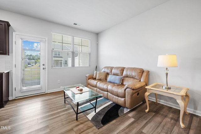 living room featuring wood finished floors and baseboards