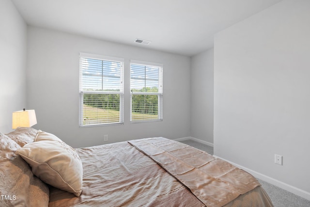 carpeted bedroom with baseboards