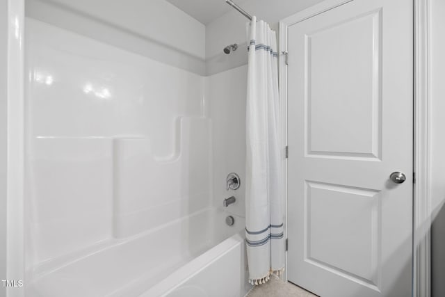 bathroom with shower / bath combination with curtain
