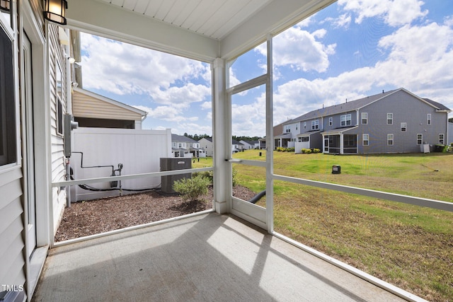 unfurnished sunroom with a residential view
