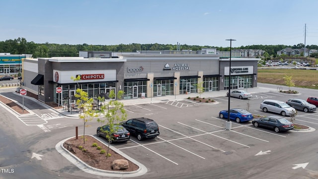 view of commercial location with uncovered parking