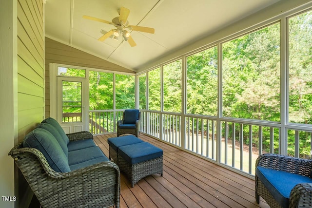 sunroom featuring a ceiling fan