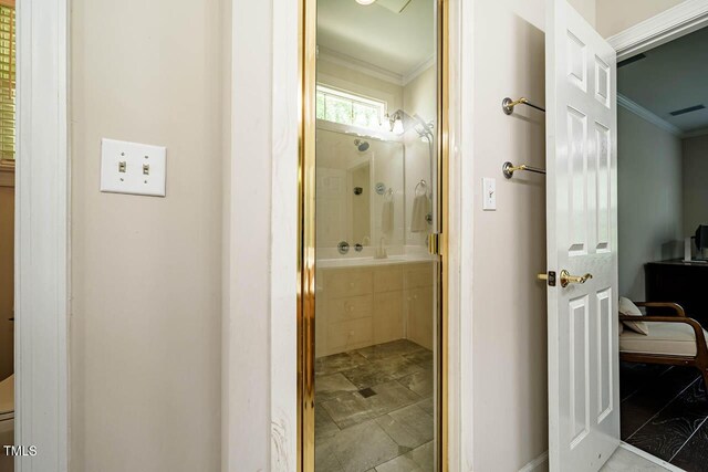 bathroom with crown molding, baseboards, visible vents, and vanity