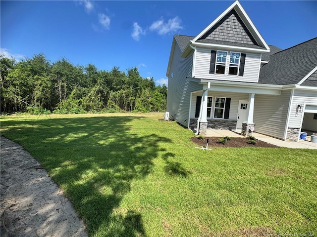303 Hendrix B Rd, Raeford, NC 28376 - view of side of property featuring a lawn, a porch, stone siding, and roof with shingles