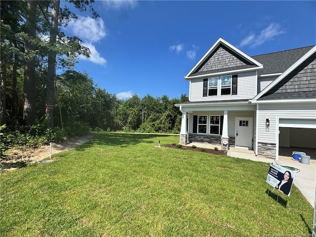 303 Hendrix B Rd, Raeford, NC 28376 - view of front facade with a front lawn, stone siding, and a shingled roof