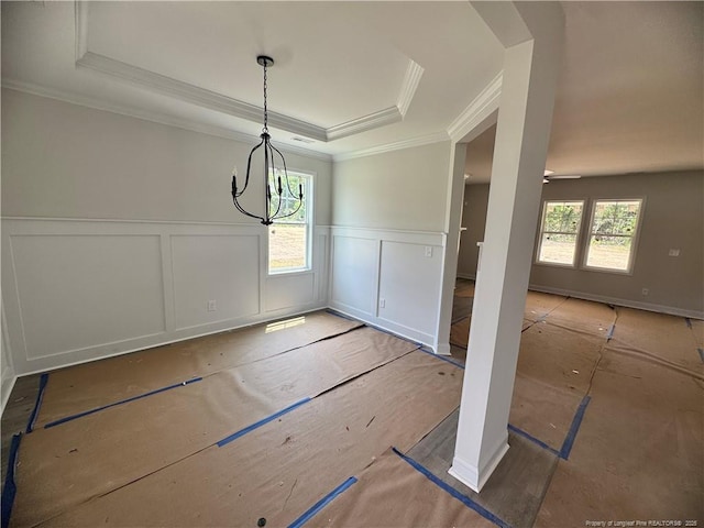 303 Hendrix B Rd, Raeford, NC 28376 - unfurnished dining area featuring a tray ceiling, a decorative wall, wainscoting, a chandelier, and ornamental molding