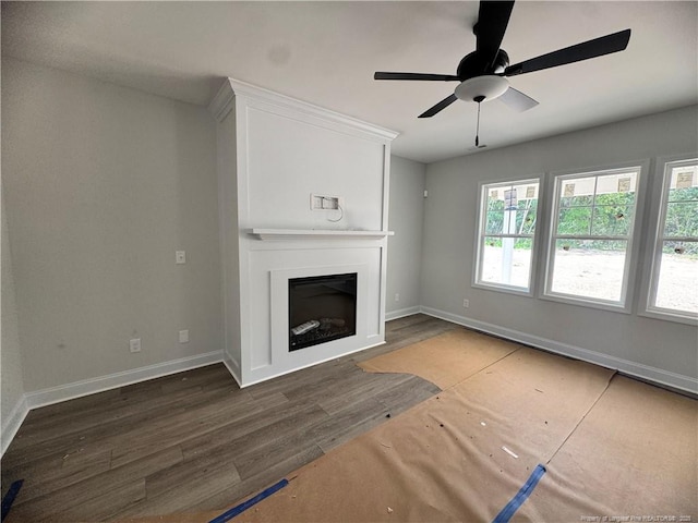 303 Hendrix B Rd, Raeford, NC 28376 - unfurnished living room featuring wood finished floors, a fireplace, and a ceiling fan