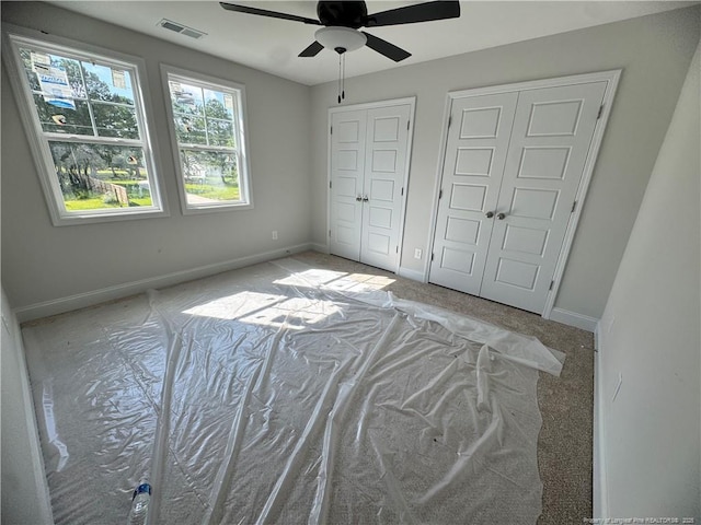 373 Hendrix C Rd, Raeford, NC 28376 - unfurnished bedroom featuring two closets and ceiling fan