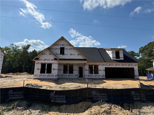 property in mid-construction featuring a fenced front yard