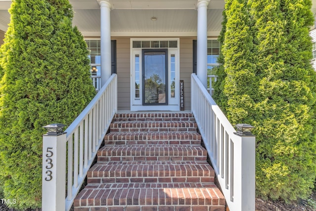 entrance to property featuring covered porch