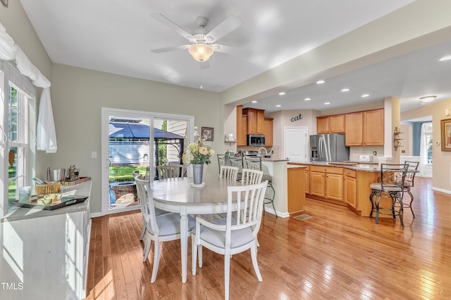 dining area with recessed lighting, light wood finished floors, ceiling fan, and baseboards