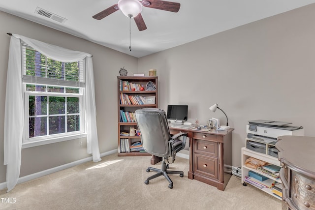 office area featuring carpet floors, ceiling fan, baseboards, and visible vents