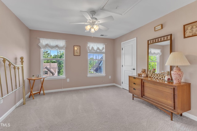 living area with baseboards, carpet, a ceiling fan, and visible vents