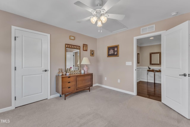 bedroom featuring a ceiling fan, baseboards, visible vents, and carpet