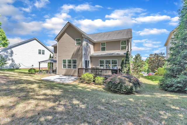 back of house with a patio, a yard, a deck, and a gazebo