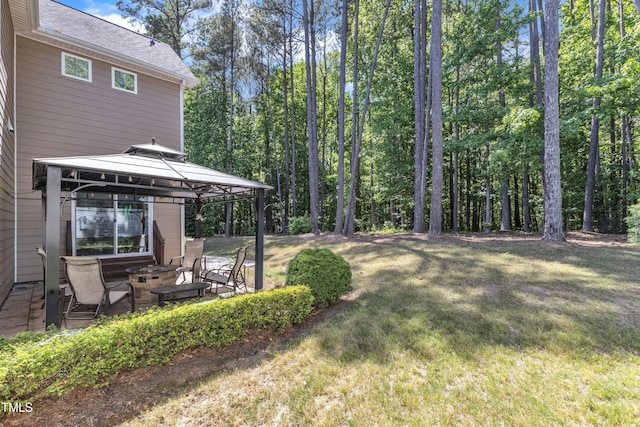 view of yard featuring a gazebo and a patio area