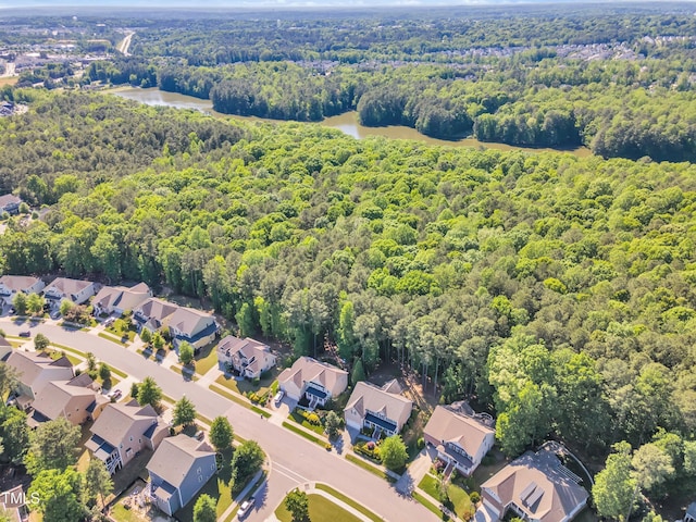 aerial view with a water view, a residential view, and a wooded view